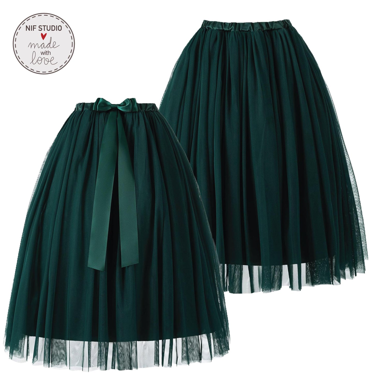 two dark green tulle skirts with green ribbons tied at the waist.
