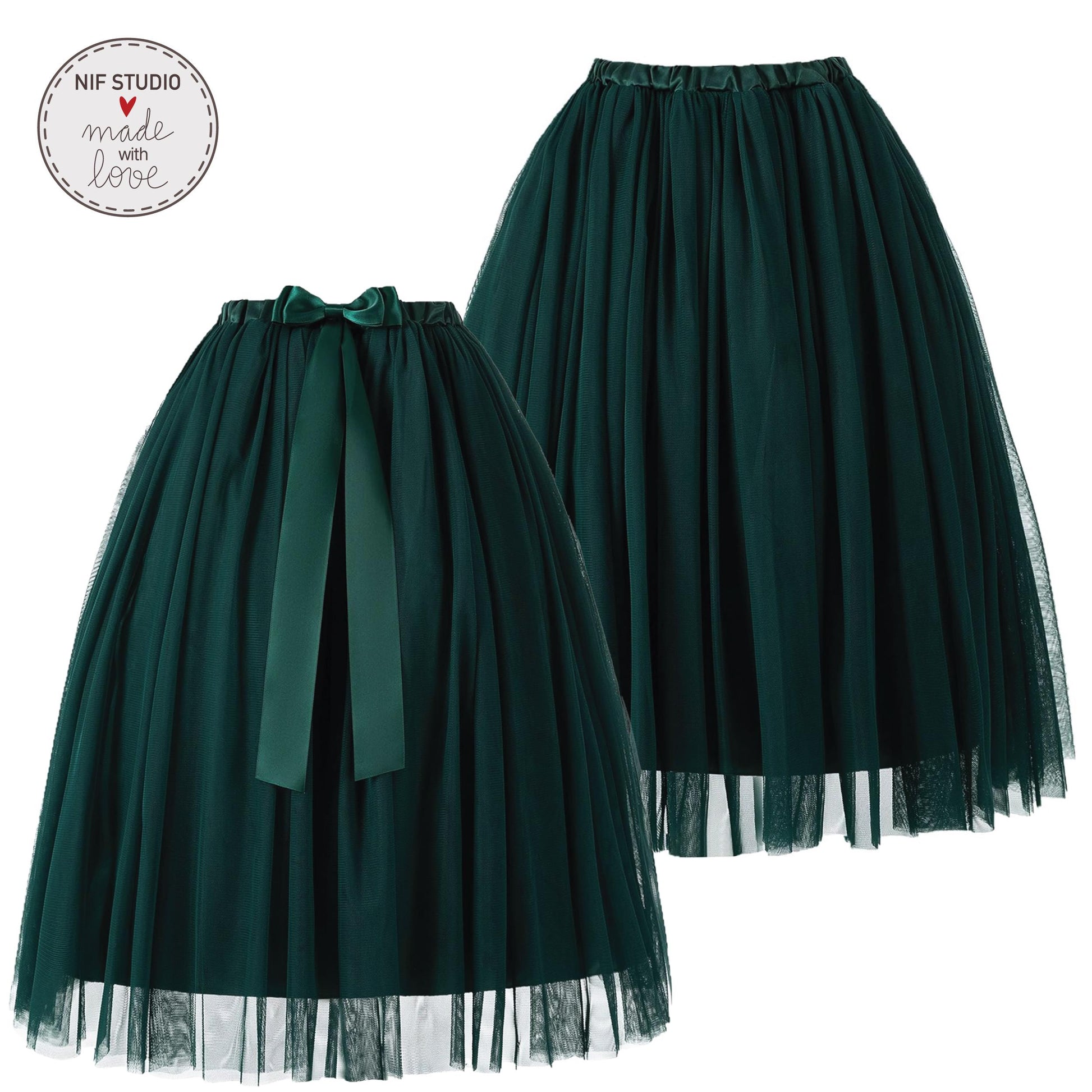 two dark green tulle skirts with green ribbons tied at the waist.