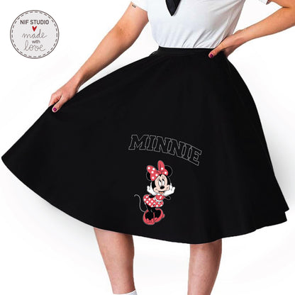A woman wearing a black skirt with a Minnie Mouse printed on it.