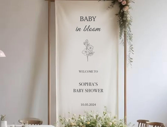 a banner for a baby shower, with floral decorations and text welcoming guests to a baby shower for Sophia.