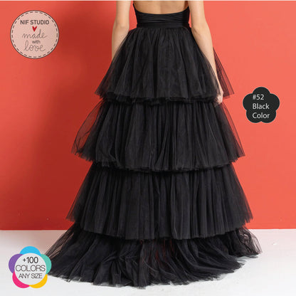 a woman wearing a black tiered dress