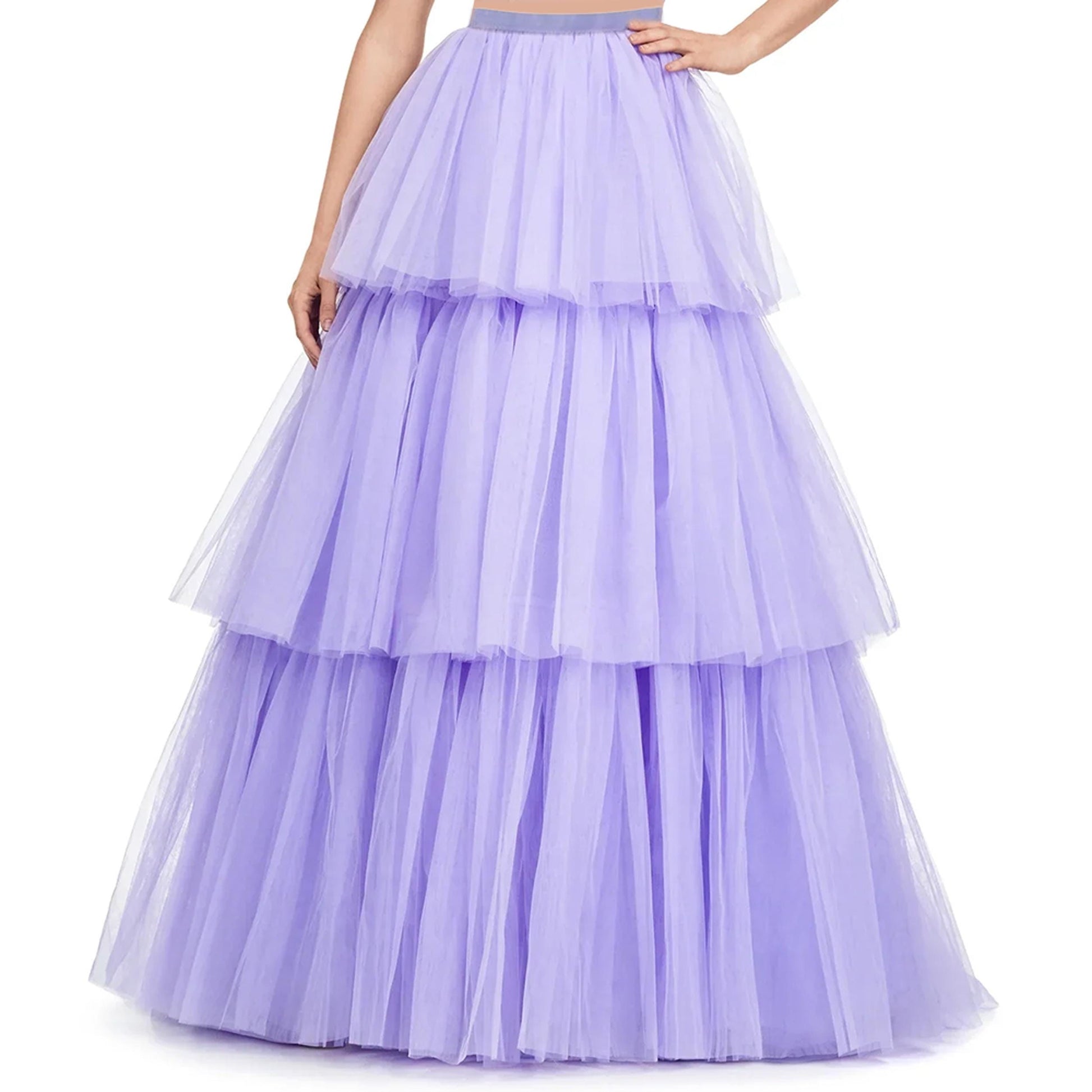 A woman wearing a long, voluminous, tiered purple tulle skirt.