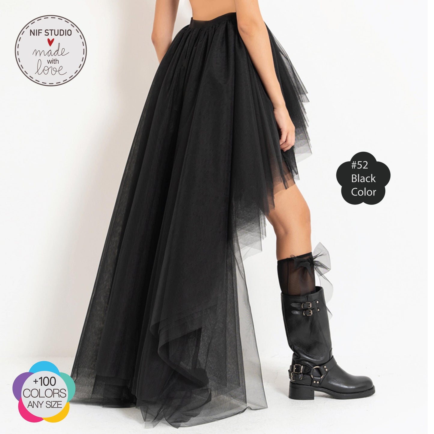 a woman wearing a black dress and boots