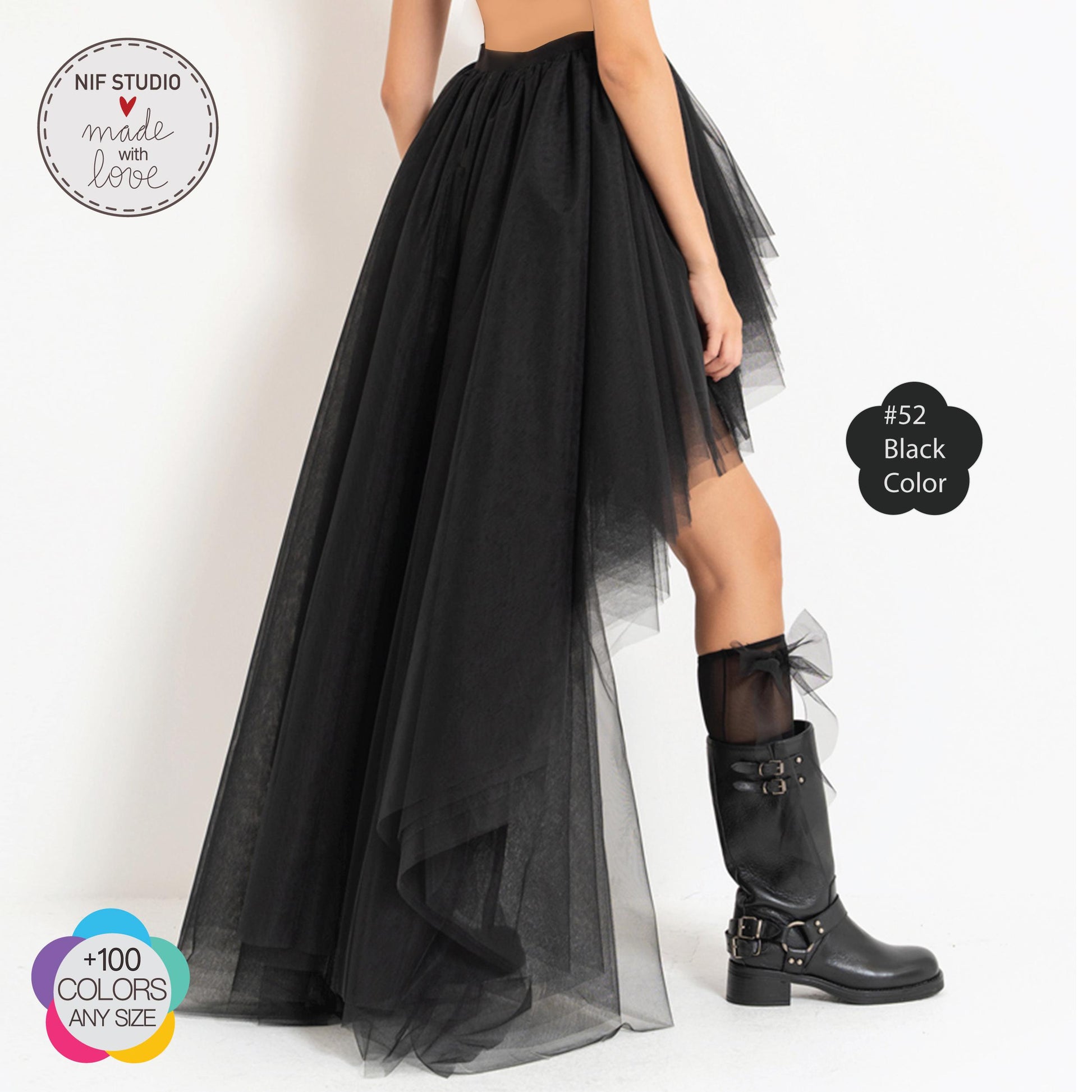 a woman wearing a black dress and boots