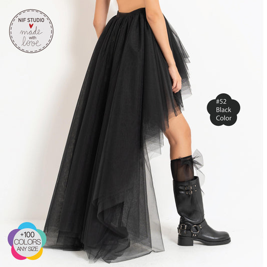 a woman wearing a black dress and boots