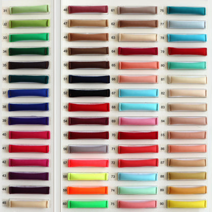 a large display of different colors of satin ribbons