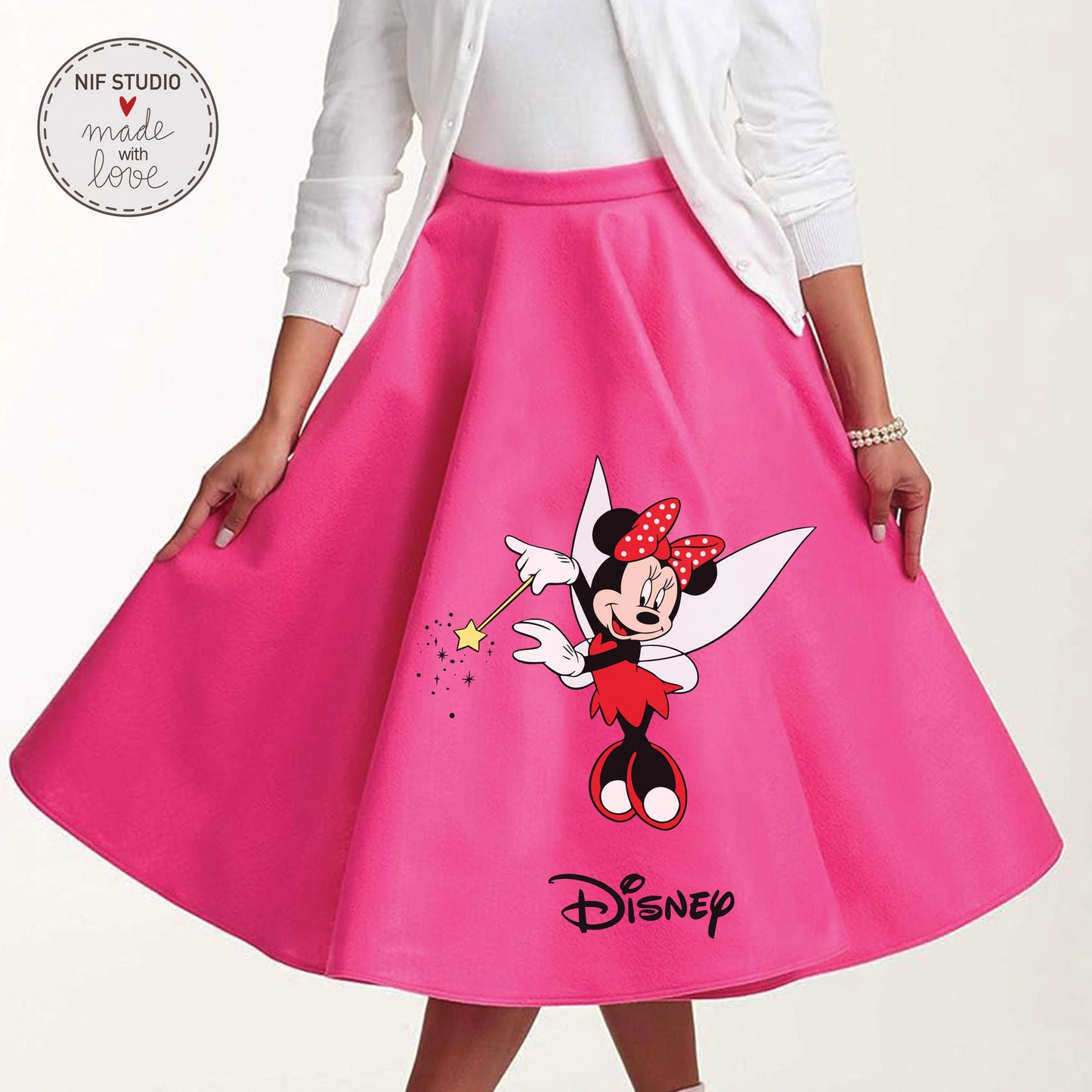 A woman wearing a bright pink skirt with a Minnie Mouse design on it.