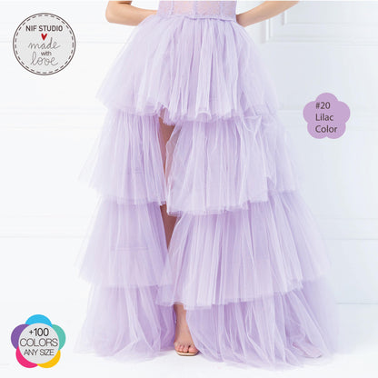 a woman wearing a purple tiered skirt