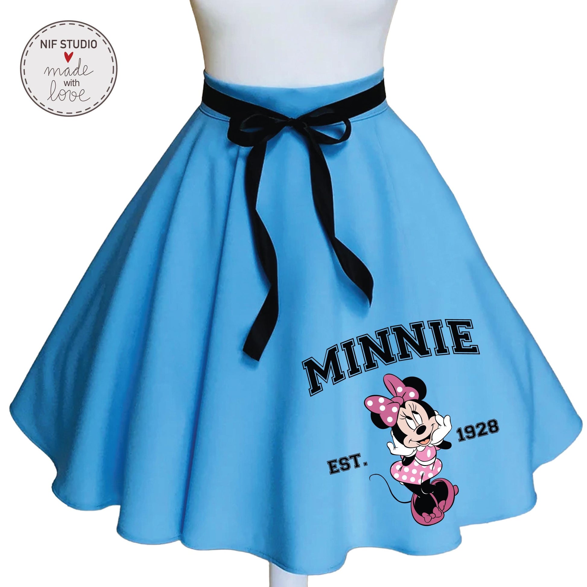 A blue skirt with a Minnie Mouse design and the text &quot;MINNIE EST. 1928&quot; printed on it.