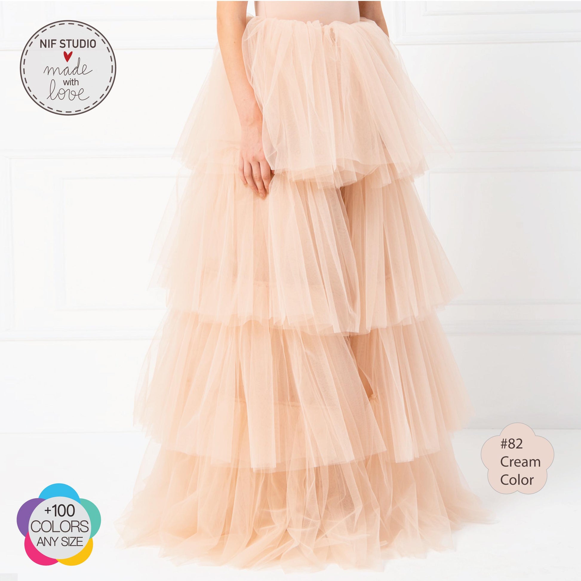 a woman in a dress with a tiered skirt