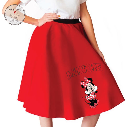 A woman wearing a red skirt with a Minnie Mouse printed on it.