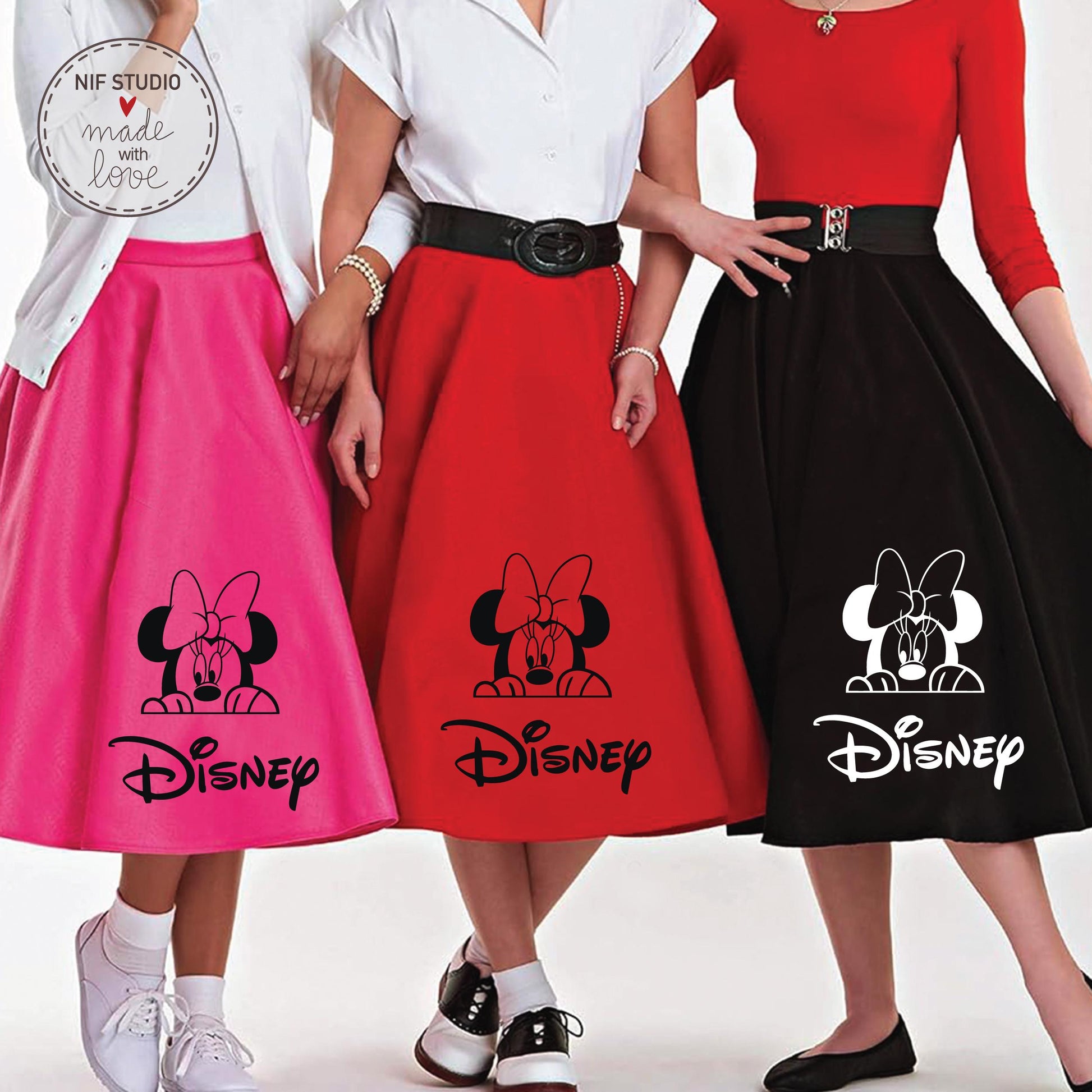Three women wearing Disney-themed skirts, each with a different color and design.