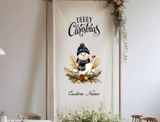 A banner with a snowman and winter decorations, along with the text &quot;Merry Christmas&quot; and &quot;Custom Name&quot; printed on it.