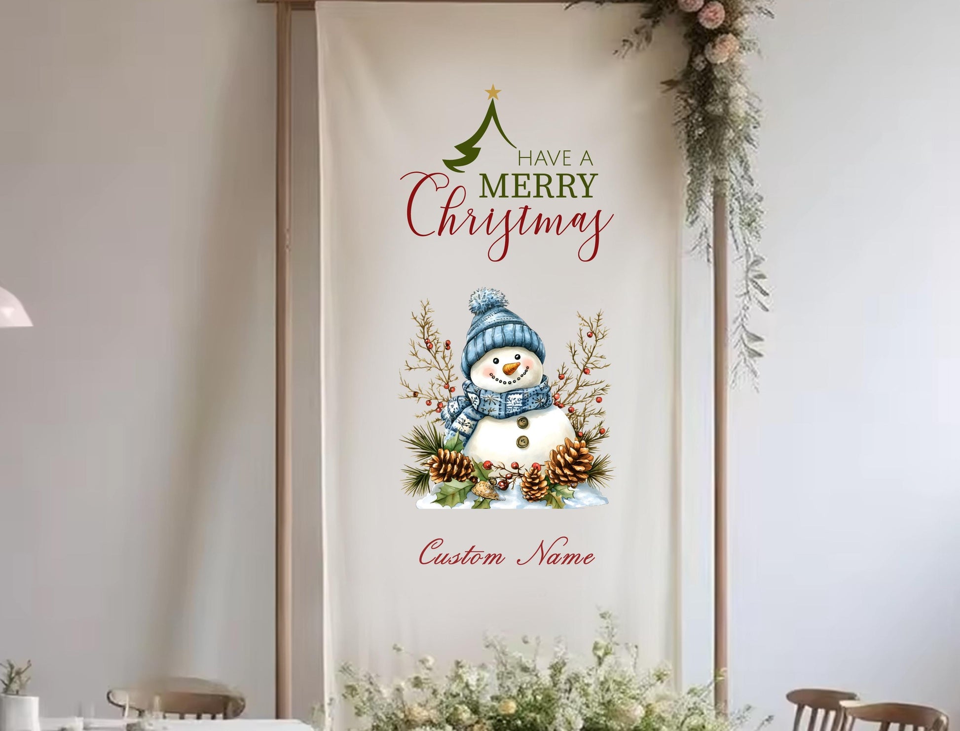 A banner with a snowman and Christmas decorations hanging on a wall, with the text &quot;Have a Merry Christmas&quot; and &quot;Custom Name&quot; below.
