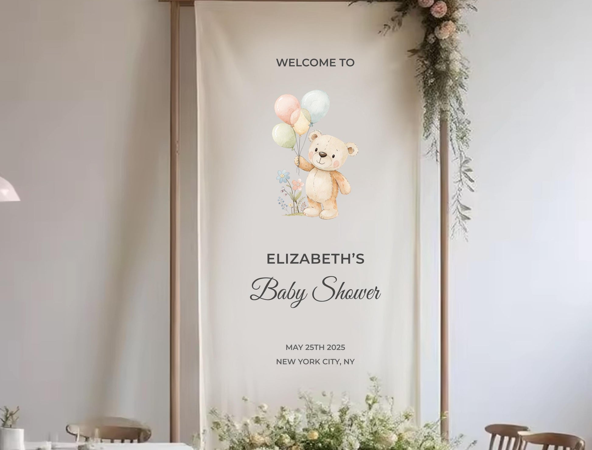 The image is a banner for a baby shower, featuring a teddy bear holding balloons and text welcoming guests to Elizabeth&#39;s baby shower.