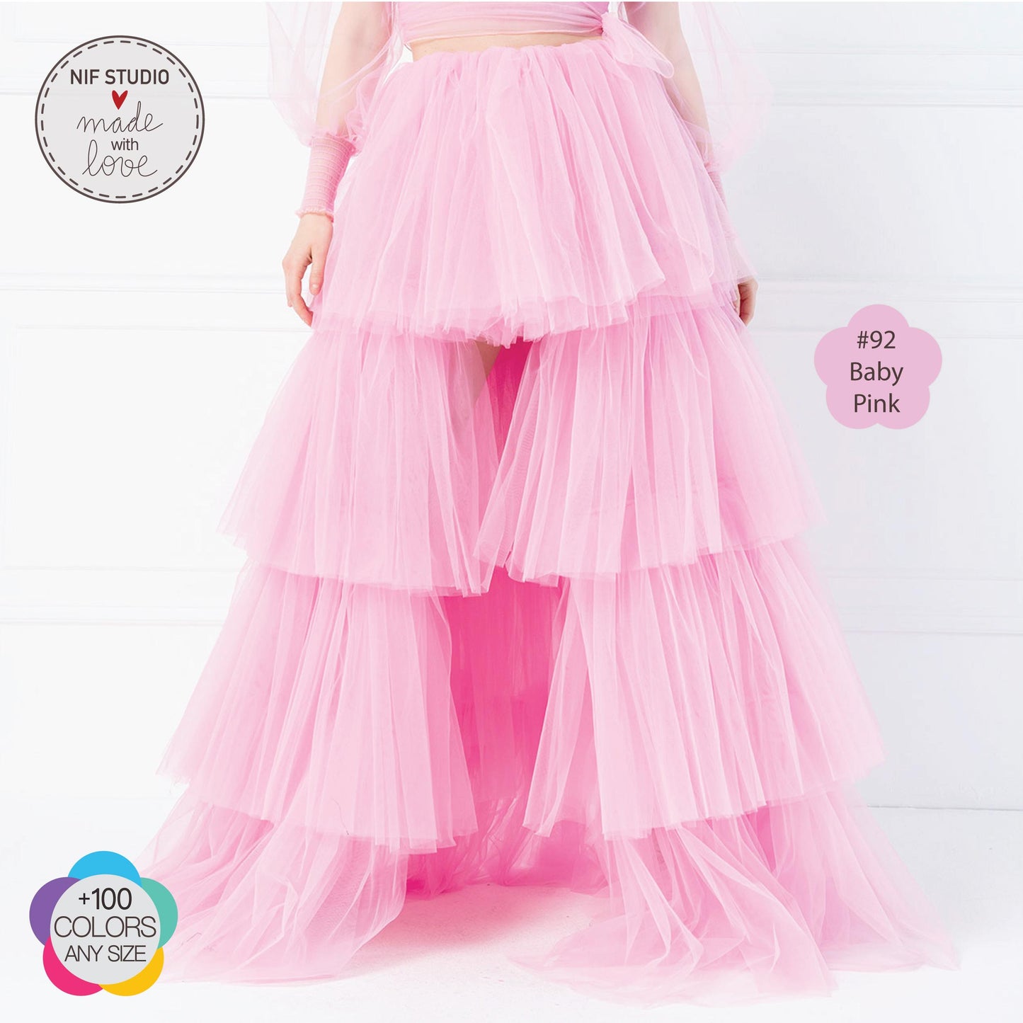 a woman in a pink dress with a long skirt