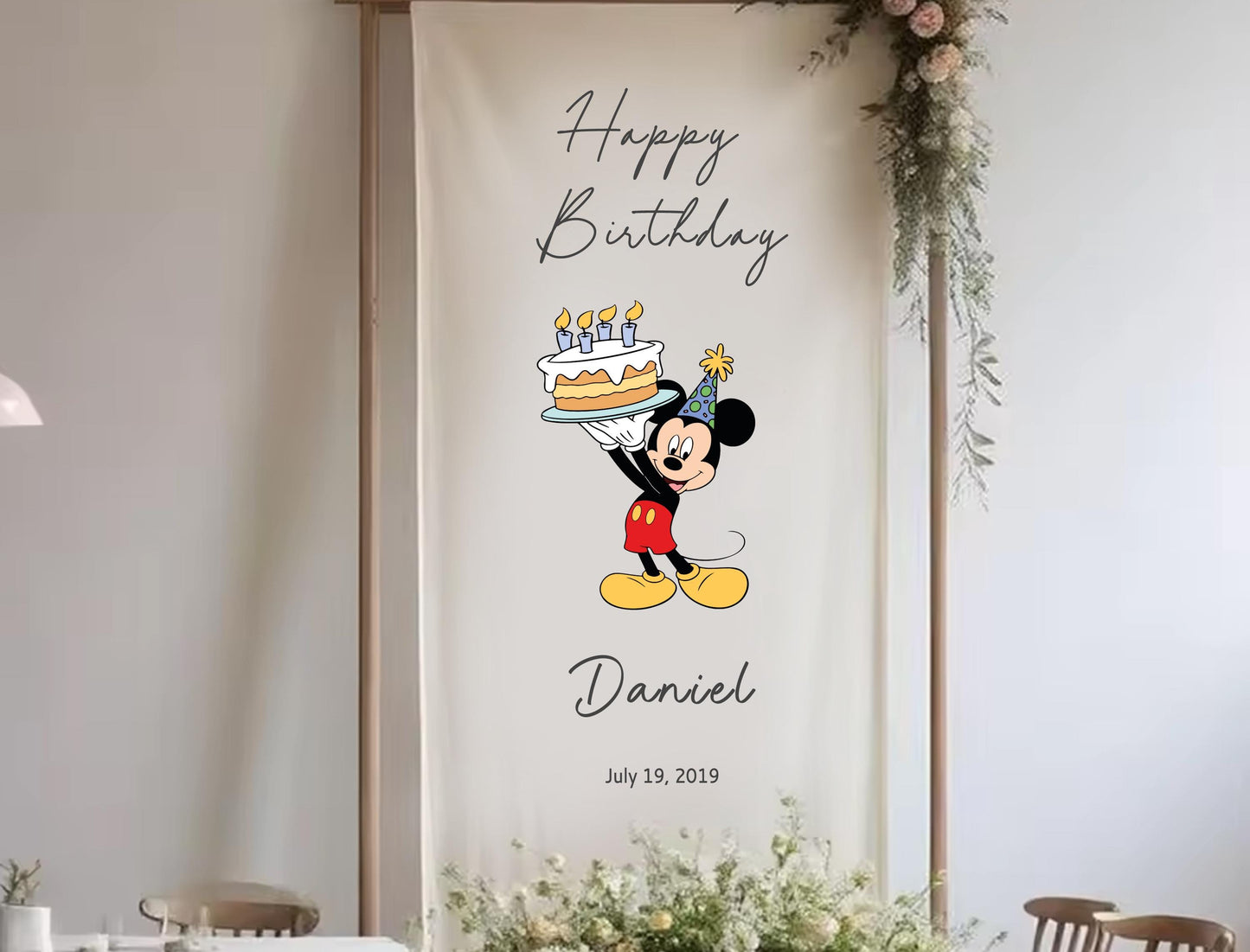 A banner with a cartoon character holding a birthday cake, celebrating Daniel&#39;s birthday.