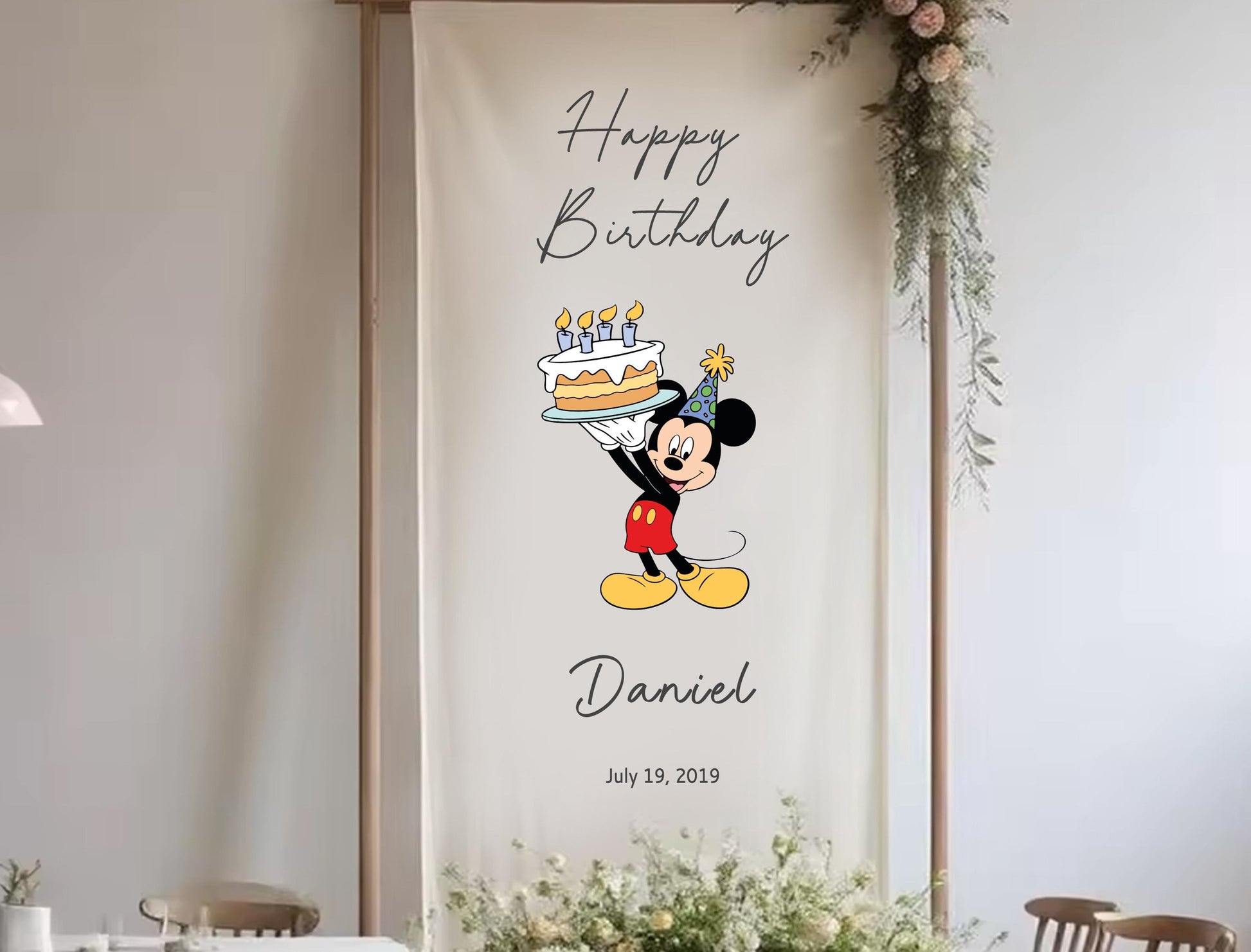 A banner with a cartoon character holding a birthday cake, celebrating Daniel&#39;s birthday.